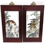 A PAIR OF CHINESE PORCELAIN PLAQUES decorated with scenes of tigers in mountainous landscapes,