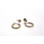 A PAIR OF 9 CARAT GOLD SINGLE STONE DIAMOND EARSTUDS the brilliant cuts totalling approximately 0.