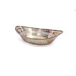 A SILVER BREAD BASKET by Barker Brothers, Chester 1921, of navette shape, pierced decoration with