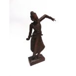A SIAMESE CARVED WOODEN FIGURE of a dancing female on rectangular base, 70cm high