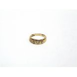 A THREE STONE DIAMOND 18 CARAT GOLD RING London 1899, the graduated star set old brilliant cuts