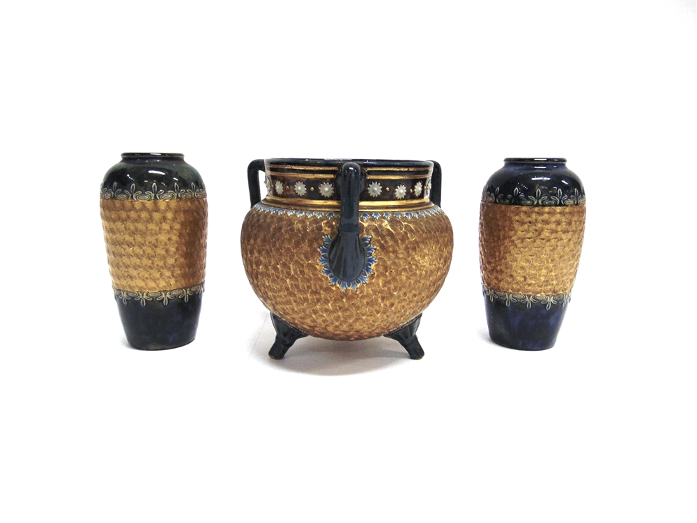 A DOULTON STONEWARE JARDINIERE OF CAULDRON FORM with three handles, on prong feet, 18cm high 20cm
