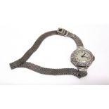 A LADY'S DIAMOND WRISTWATCH the unsigned silvered dial with black Arabic numerals and hands, the