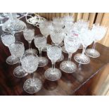 NINE MATCHING CUT GLASS SHERRY GLASSES 12cm high, star cut bases; and six matching liqueur glasses