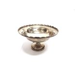 A SMALL SILVER COMPORT by Thomas Bishton, Birmingham 1944, the bowl with castellated rim on a