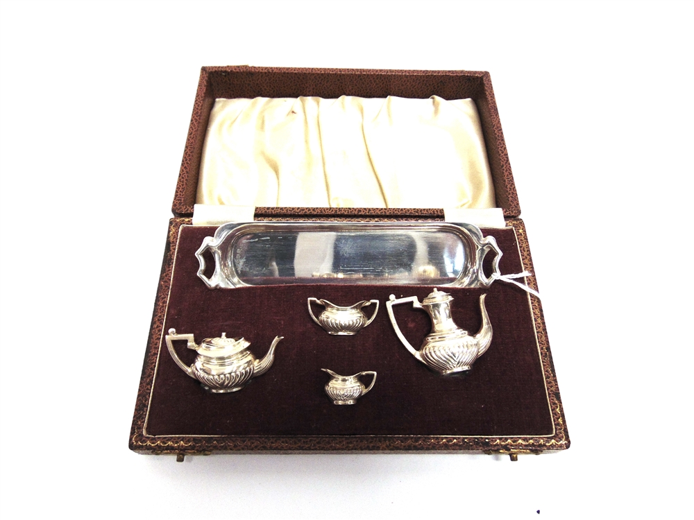 A MINIATURE SILVER FOUR PIECE TEA AND COFFEE SERVICE maker HCD, Birmingham 1959, with a two