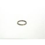 A DIAMOND FULL ETERNITY RING the 26 single cuts set in an unmarked white mount, finger size P, 2.