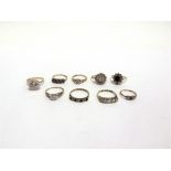 A COLLECTION OF NINE STONE SET 9 CARAT GOLD RINGS 21g gross