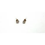 A PAIR OF SINGLE STONE DIAMOND EARSTUDS unmarked, the mirror set brilliant cuts totalling