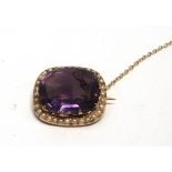 A VICTORIAN AMETHYST AND SEED PEARL BROOCH stamped '15ct', 2.1cm by 1.9cm, 6.6g gross