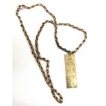 A 9 CARAT GOLD INGOT on a chain tagged '9c', 48cm long, 27g gross