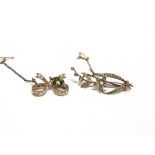 A SEED PEARL SET SPRAY BROOCH stamped '9K', 4.6cm long, 3.5g gross; with a seed pearl set bow