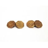 A PAIR OF CUFFLINKS stamped '14', the octagonal panels with an engine turned border, monogrammed,