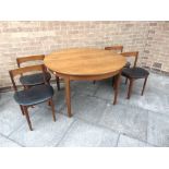 A G PLAN STYLE TEAK DINING TABLE AND CHAIRS comprising extending circular table 121cm diameter (