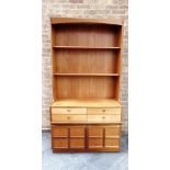 A NATHAN TEAK WALL UNIT with two adjustable shelves, four drawers over cupboards to base, 102cm wide
