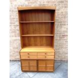 A NATHAN TEAK WALL UNIT with two adjustable shelves, four drawers over cupboards to base, 102cm wide