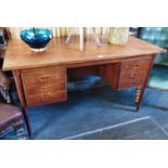 A 1960s DANISH TEAK TWIN PEDESTAL DESK the rectangular top 132cm wide 67cm deep, on tapering