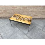 A 1960S TILE TOP TABLE on chrome supports, the fifteen tiles with abstract decoration, 77cm long