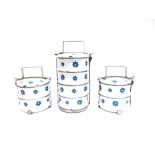 THREE FRENCH ENAMEL 'TIFFIN' STYLE STACKING CONTAINERS with floral decoration