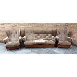 A 1960S G PLAN TEAK FRAMED 'SADDLEBACK' THREE PIECE SUITE comprising three seater sofa and pair of