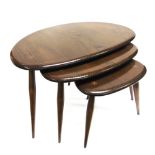 A NEST OF THREE ERCOL 'PEBBLE' OCCASIONAL TABLES the largest 66cm wide 44cm deep 40cm high