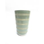 KEITH MURRAY FOR WEDGWOOD: A vase of tapering form with five bands of incised lines, 20.5cm high