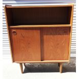 A DANISH TEAK BOOKCASE WITH OPEN SHELF above sliding doors, 89cm wide 26cm deep 108cm high