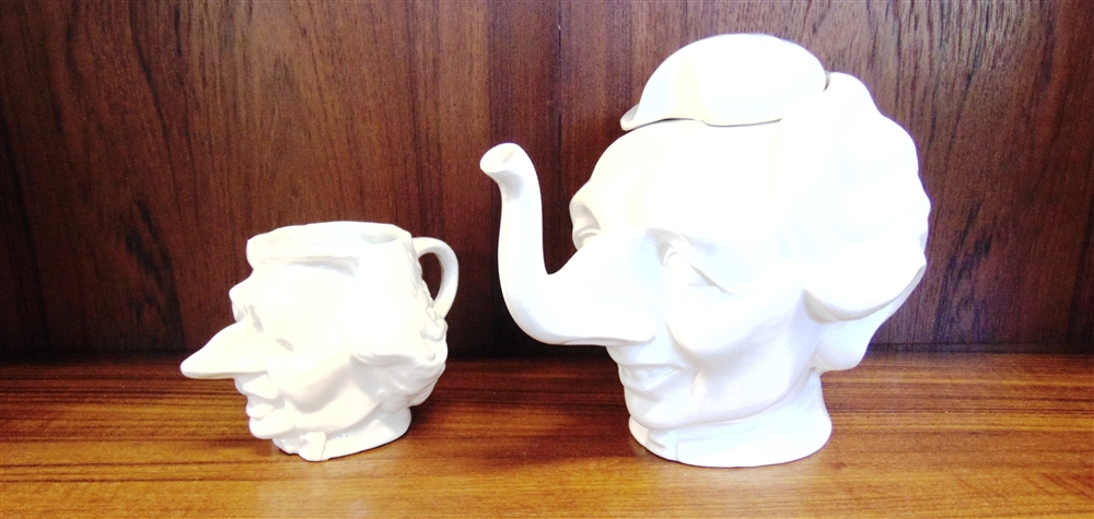 A 'FLUCK AND LAW' MARGARET THATCHER NOVELTY TEAPOT 21cm high and similar jug 11cm high