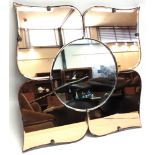 A MID-CENTURY TWO-TONE WALL MIRROR in Art Deco style, 77cm wide from point to point