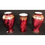 A PAIR OF KEELING & CO. LTD. 'LOSOL WARE' VASES of baluster form with gilt decoration on a red