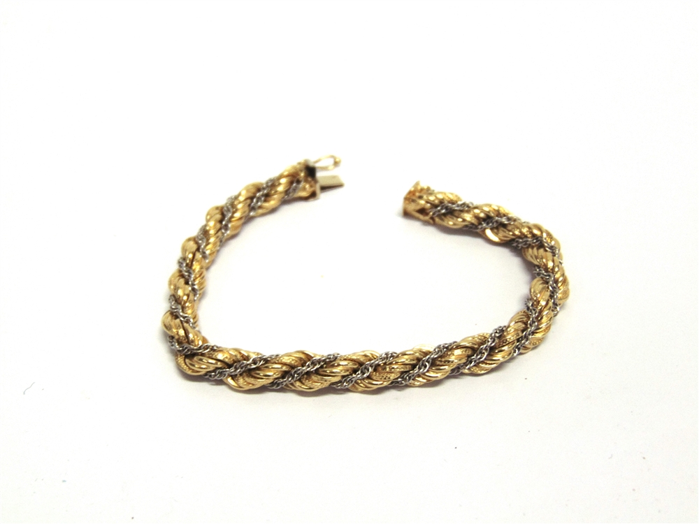 A BRACELET stamped ;750', of hollow rope links wrapped with a white box link chain, 18c, long, 15.9g