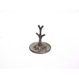 A SILVER RING TREE by Mappin Brothers, Birmingham, date letter rubbed, embossed base 6.4cm diameter,