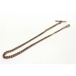 A 9 CARAT GOLD WATCH CHAIN of graduated solid curb links, with T bar and swivel, 46.5cm long, 40g