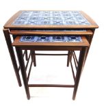 A NEST OF THREE DANISH TILE TOP OCCASIONAL TABLES the largest 54cm wide 36cm deep 52cm high