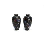 A PAIR OF CLOISONNE VASES of baluster form, floral decoration on a black ground, signed to base,