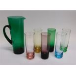 A 1960S COLOURED GLASS LEMONADE SET comprising jug and six tumblers, the jug 27cm high