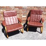 A PAIR OF LEATHER UPHOLSTERED LOUNGE CHAIRS with cantilever bentwood frames