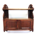 A MAHOGANY HANGING CABINET with open fret carved sides, 62cm wide 66cm high 15cm deep