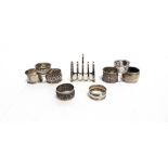 A COLLECTION OF SEVEN SILVER NAPKIN RINGS various makers and dates; an Indian napkin ring; and a