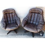 H W KLEIN FOR BRAMIN MOBLER, DENMARK: a pair of leather upholstered swivel bucket armchairs, on