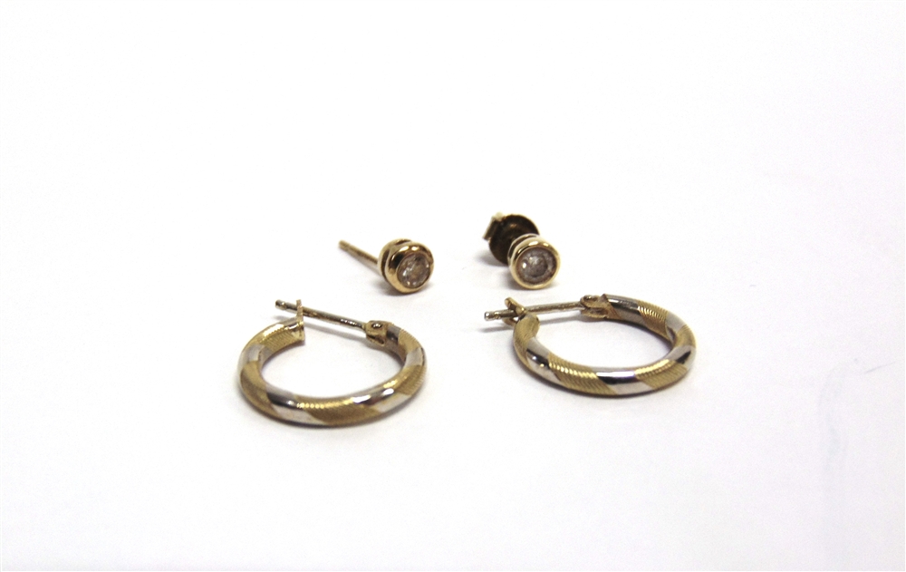 A PAIR OF 9 CARAT GOLD SINGLE STONE DIAMOND EARSTUDS the brilliant cuts totalling approximately 0.