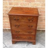 A SMALL EDWARDIAN FIGURED MAHOGANY CHEST OF FOUR GRADUATED DRAWERS on bracket feet, 53cm wide 37cm