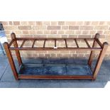 A LARGE PITCH PINE STICK STAND with removable metal drip tray, 123cm long 30cm deep 66cm high