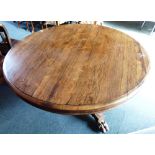 AN EARLY 19TH CENTURY ROSEWOOD BREAKFAST TABLE the circular tilt-top 129cm diameter, on acanthus