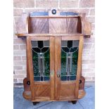 A MAHOGANY HANGING CABINET with leaded and stained glass doors, 81cm wide 177cm high 20cm deep