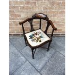 AN EDWARDIAN INLAID MAHOGANY CORNER CHAIR on turned supports with stretcher