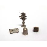 A SILVER 'ENVELOPE' STAMP CASE Birmingham 1905; a metal St George and the Dragon finial desk seal,