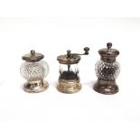 A GLASS AND SILVER MOUNTED PEPPER MILL Birmingham 1890; with another similar, Sheffield 1910; both