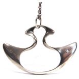 A GEORG JENSEN SILVER PENDANT ON CHAIN to a design by Henning Koppel, stamped 153, Georg Jensen in a