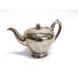 A VICTORIAN SILVER TEAPOT by Richard Pearce & George Burrows, London 1843, of tapering compressed